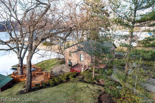 260 Oak Island Dr, Wolverine Lake, MI 48390 - view of green lawn featuring a deck