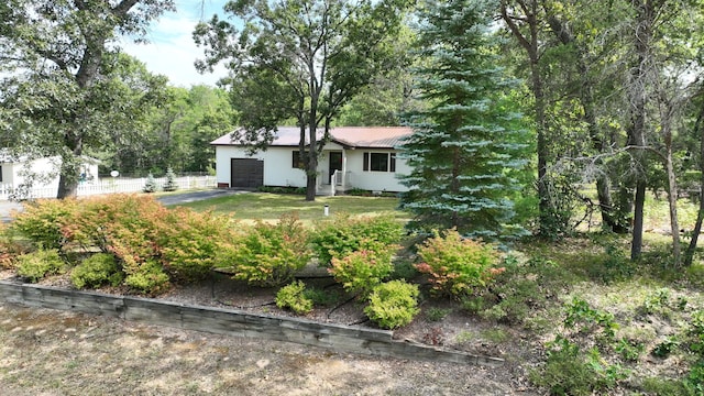 view of front facade with a garage and a front yard