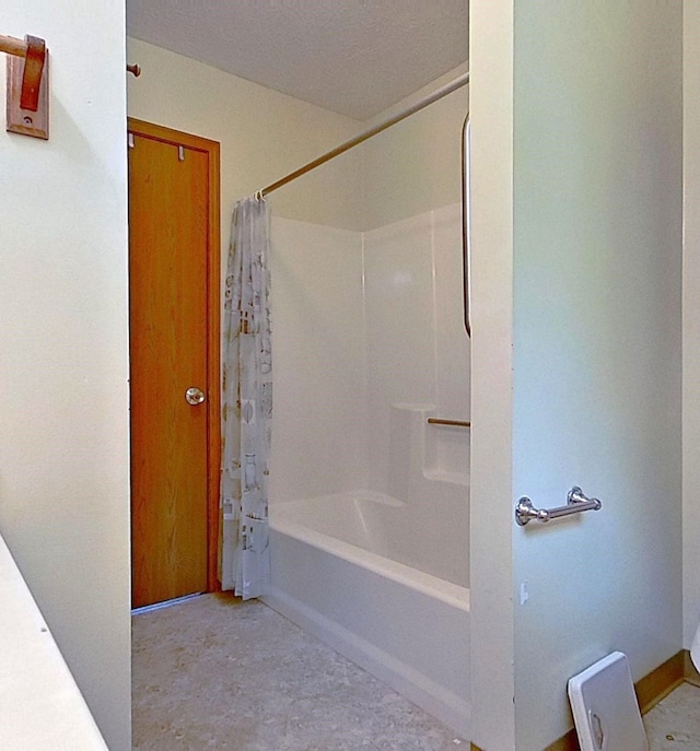 bathroom with shower / bath combination with curtain