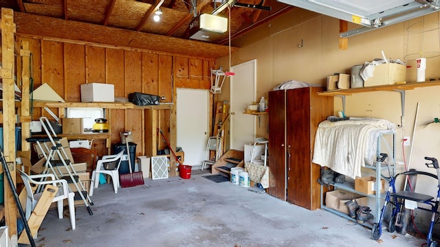 garage featuring wood walls