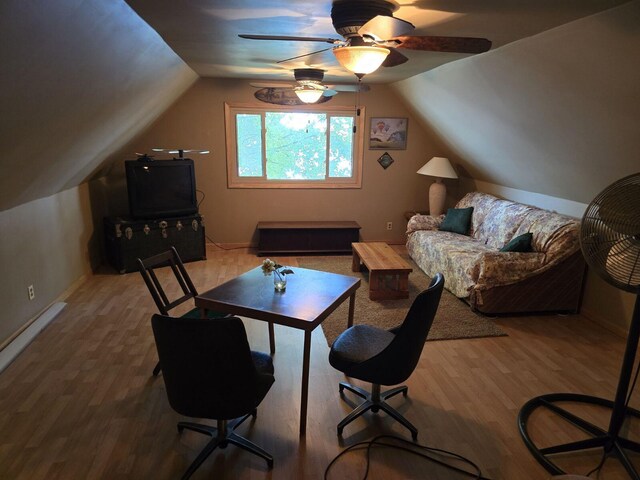 1127 Tolley Park Dr, Union City, MI 49094 - living room featuring wood finished floors, vaulted ceiling, ceiling fan, and baseboards