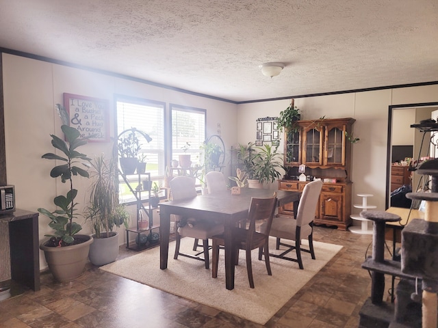 dining space with a textured ceiling