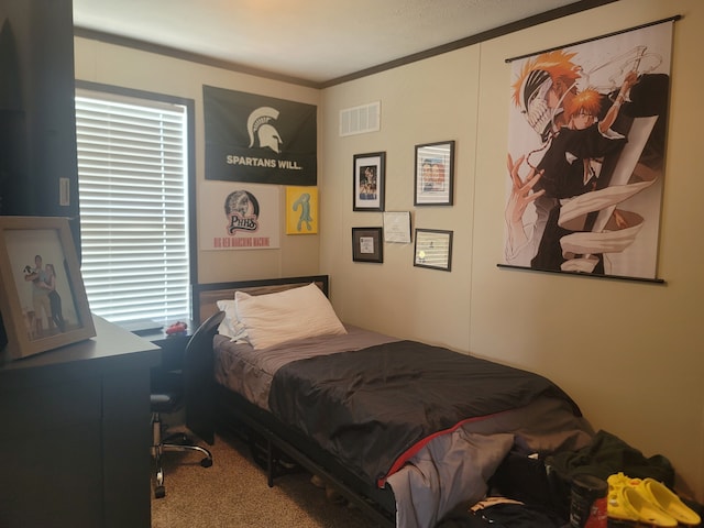 carpeted bedroom with ornamental molding