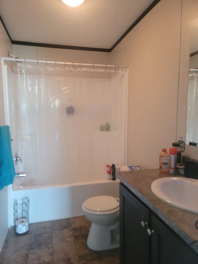 full bathroom with crown molding, vanity, toilet, and shower / tub combo