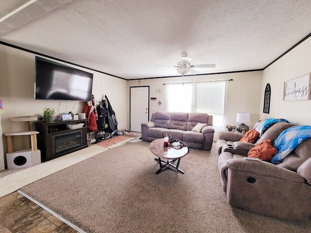 living room featuring ceiling fan and a textured ceiling