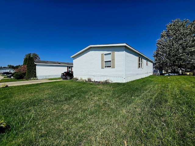 view of property exterior featuring a lawn