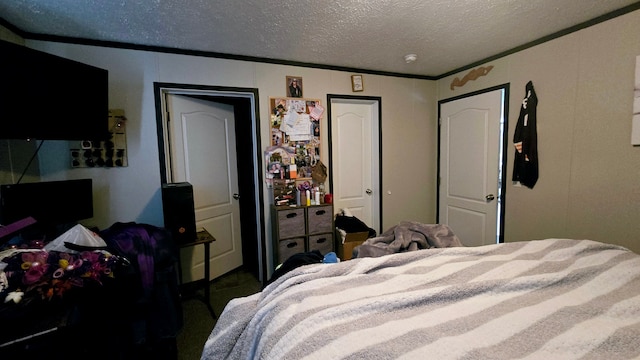 bedroom featuring crown molding and a textured ceiling