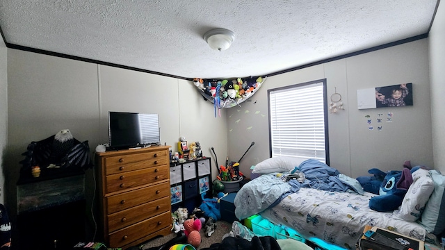 bedroom featuring crown molding and a textured ceiling