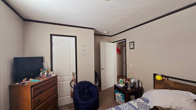 bedroom featuring ornamental molding, carpet floors, and a textured ceiling