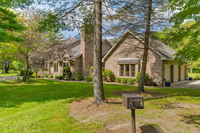 view of front of property with a front lawn and a garage