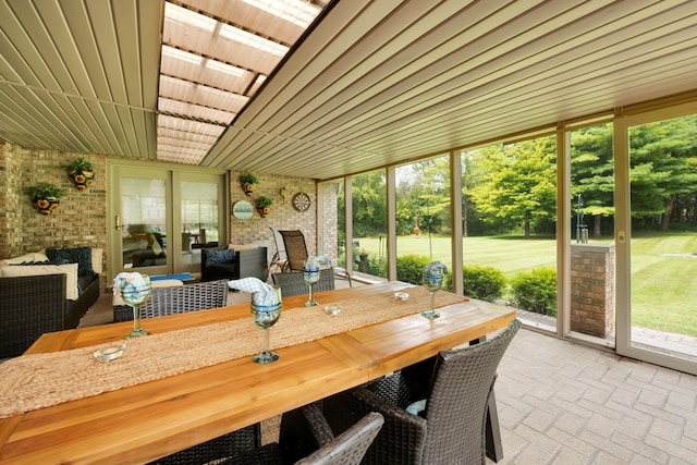 sunroom featuring a wealth of natural light and wood ceiling