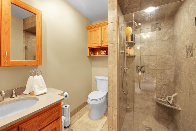 bathroom featuring vanity, an enclosed shower, and toilet