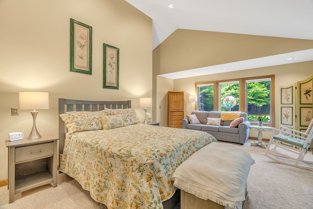 carpeted bedroom featuring high vaulted ceiling