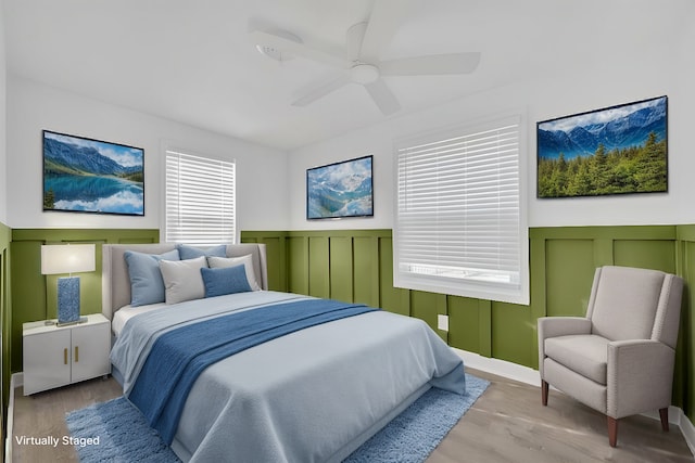 bedroom featuring ceiling fan and light wood-type flooring