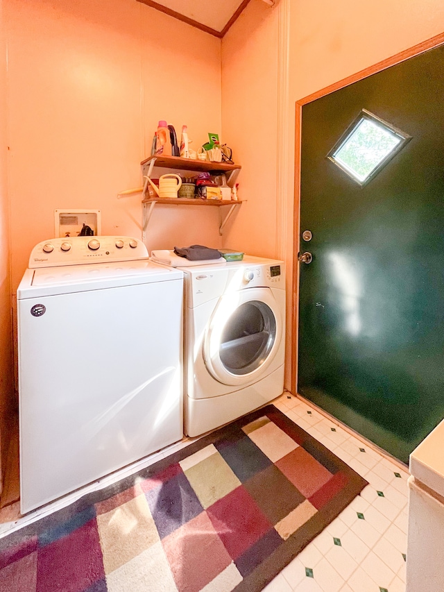 clothes washing area with separate washer and dryer