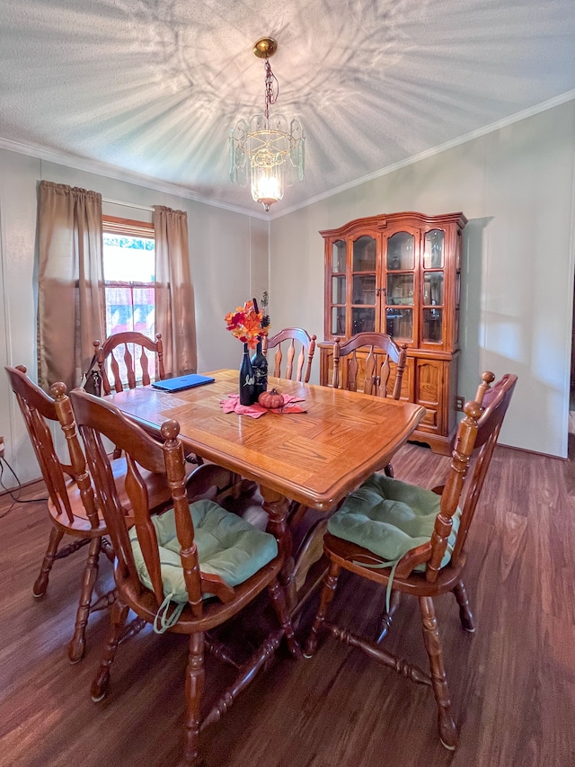 dining room featuring ornamental molding, a textured ceiling, dark hardwood / wood-style floors, and a notable chandelier