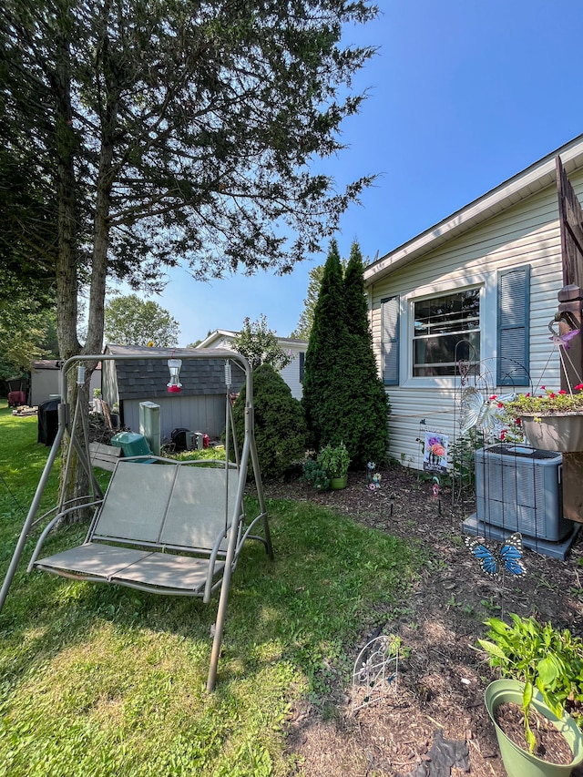 view of yard with central AC unit