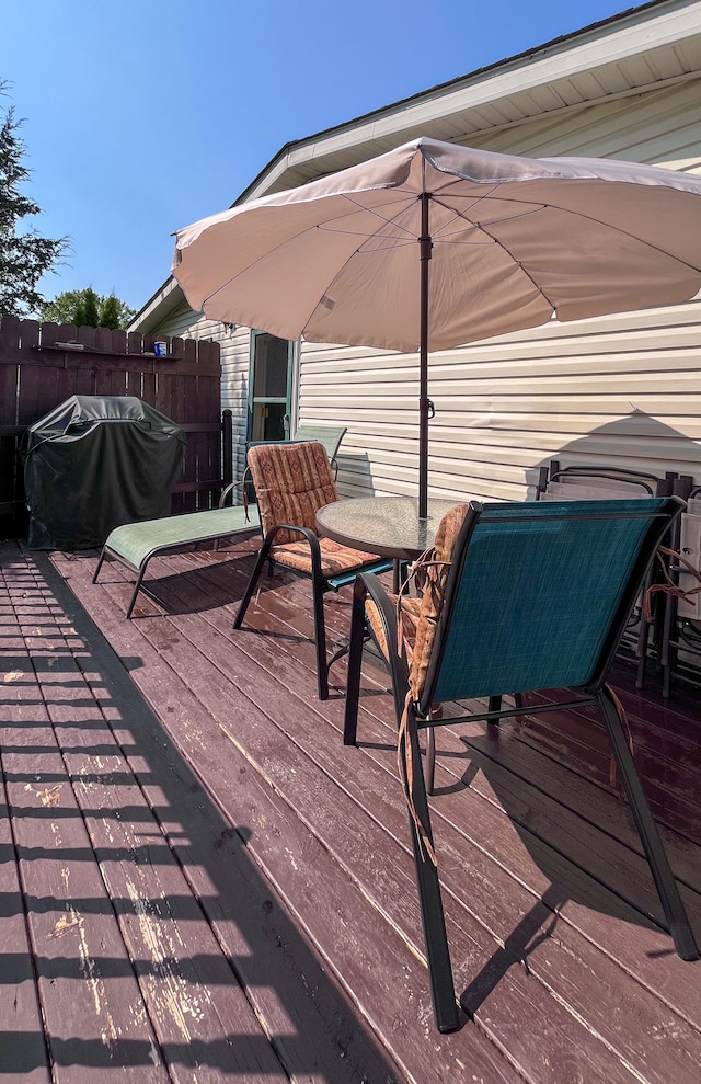 wooden terrace featuring area for grilling