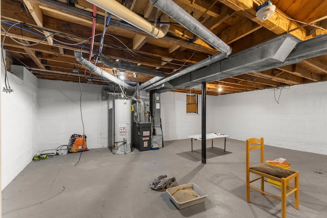 basement featuring heating unit and water heater