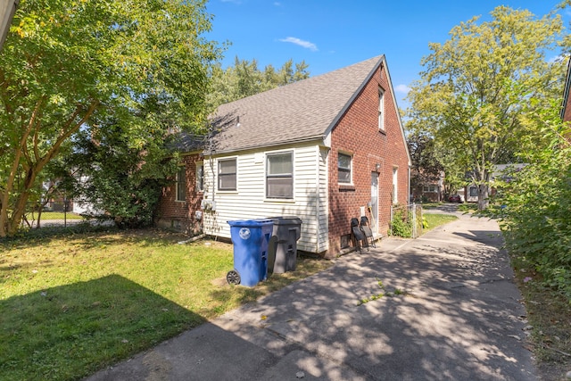 view of property exterior with a yard