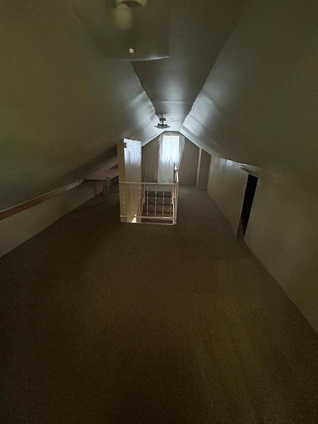 bonus room featuring carpet flooring and vaulted ceiling