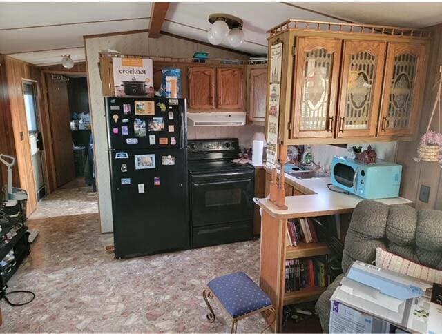 kitchen with kitchen peninsula, vaulted ceiling with beams, and black appliances