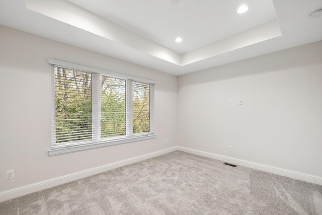 7464 Gramercy Cir Unit 19, West Bloomfield, MI 48322 - unfurnished room featuring baseboards, carpet floors, a tray ceiling, and recessed lighting
