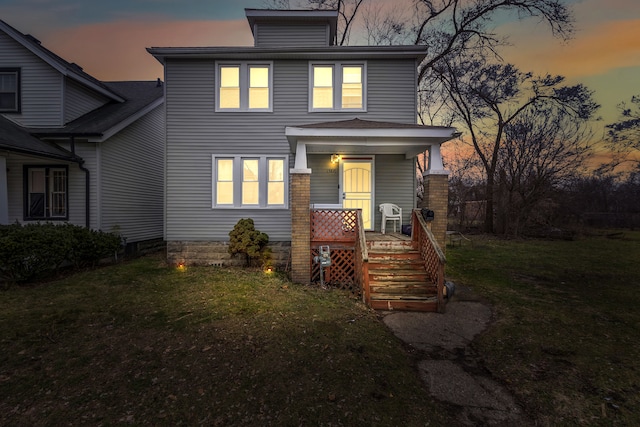 view of front of property with a yard