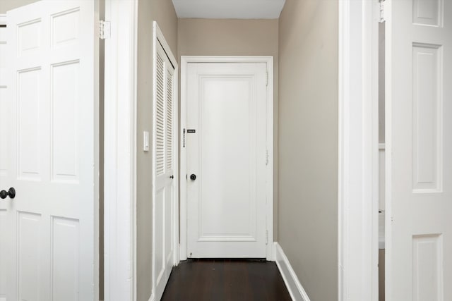 corridor with dark wood-type flooring