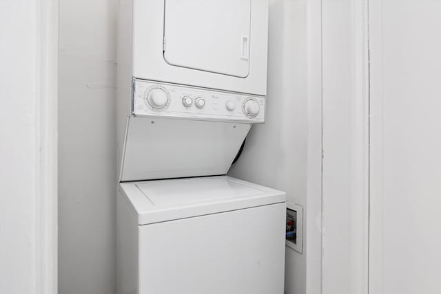 laundry room featuring stacked washer and dryer