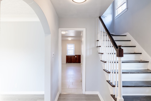 stairway with hardwood / wood-style floors