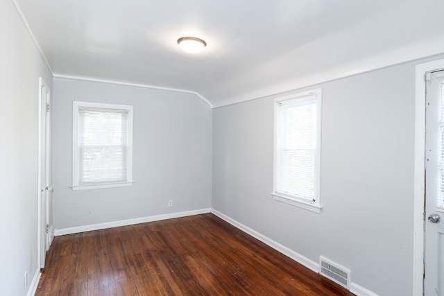 bonus room with dark hardwood / wood-style floors and a healthy amount of sunlight