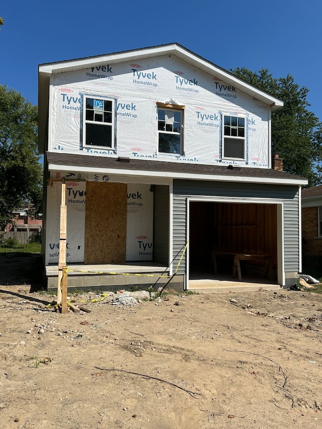 property in mid-construction featuring a garage