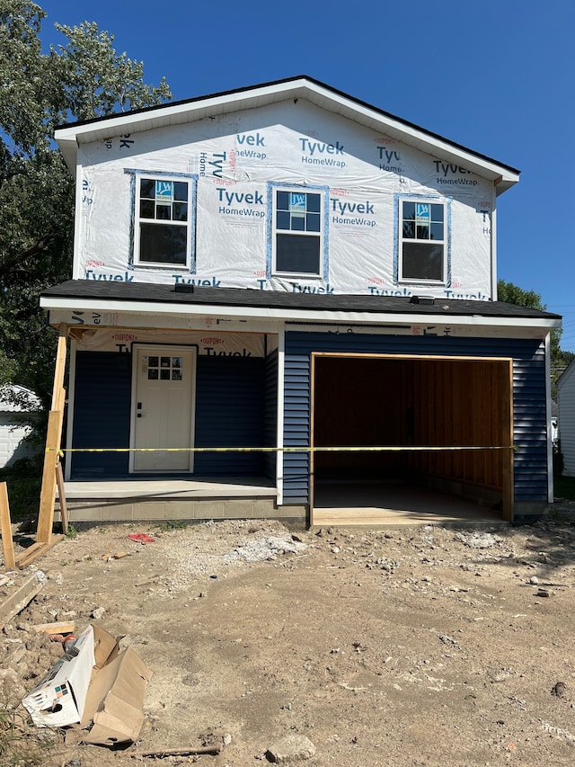 property under construction with a porch and a garage