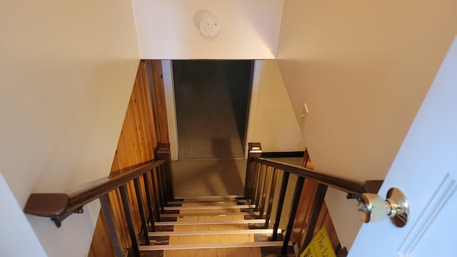 stairs featuring hardwood / wood-style flooring