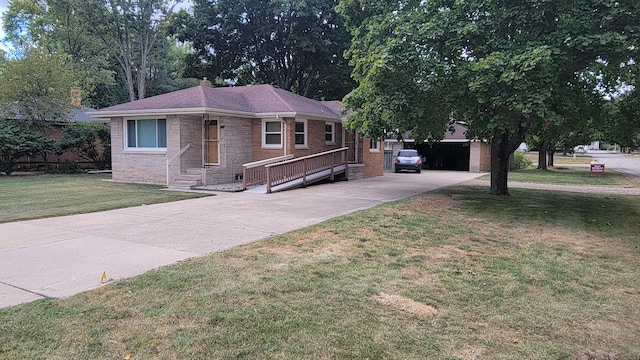 view of front of house with a garage and a front lawn