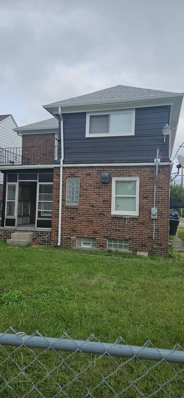 view of side of property featuring a yard