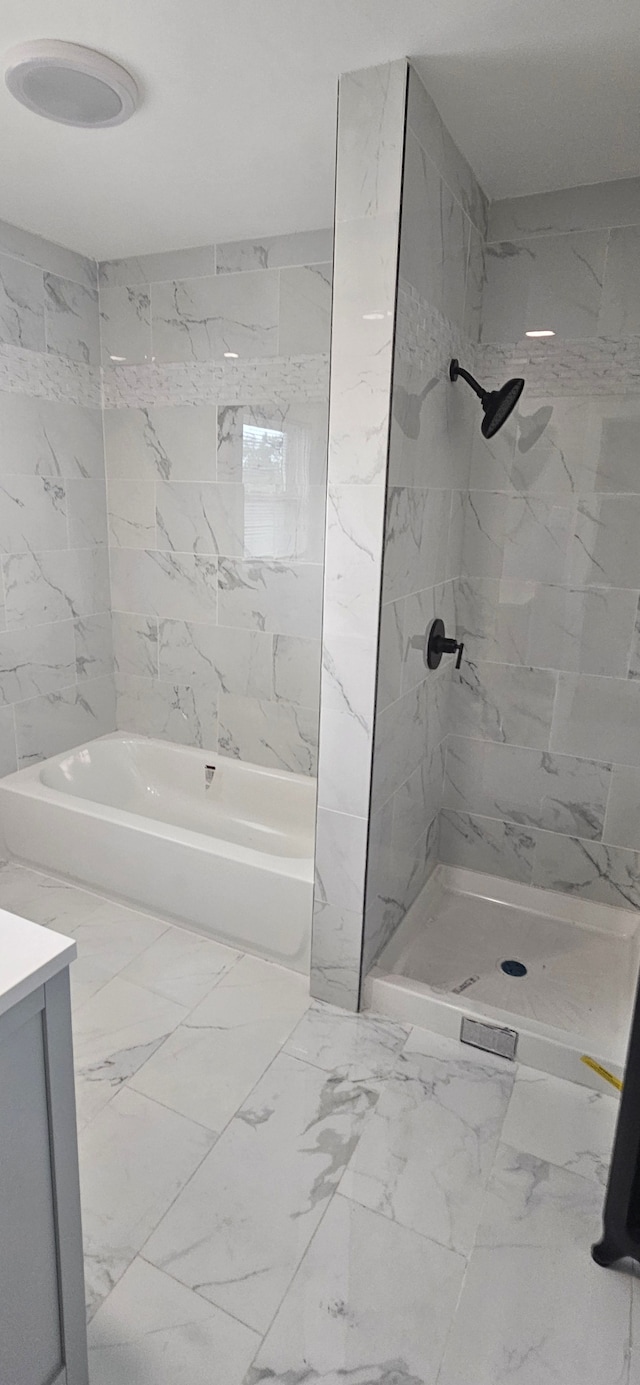 bathroom with shower with separate bathtub and vanity