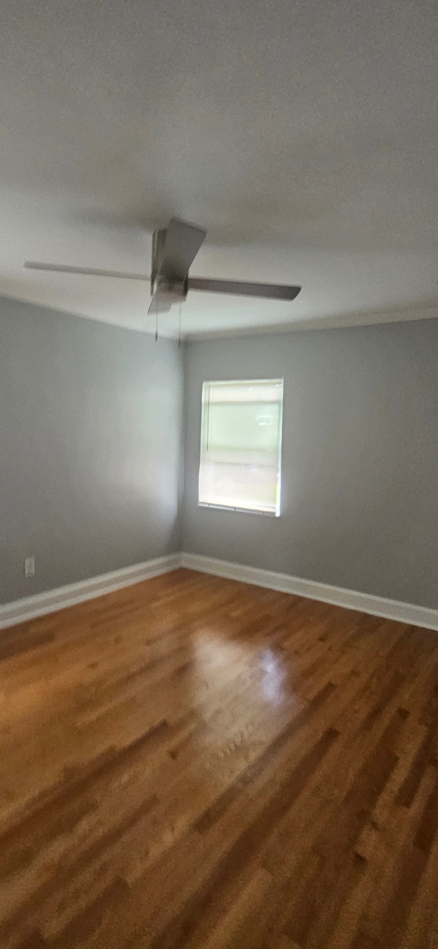 unfurnished room featuring a textured ceiling and hardwood / wood-style flooring