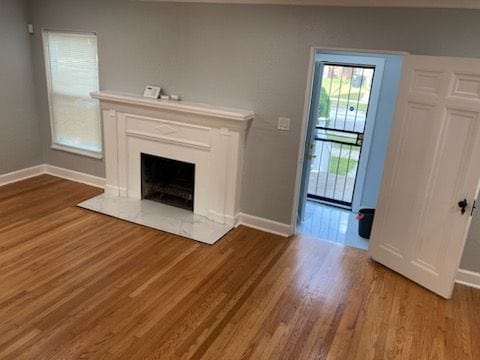 unfurnished living room featuring wood-type flooring