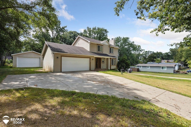 view of front of home featuring a front lawn and a garage