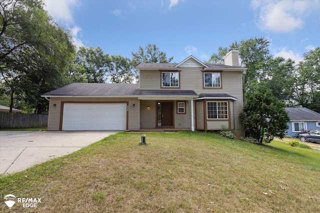 view of front property featuring a front lawn and a garage