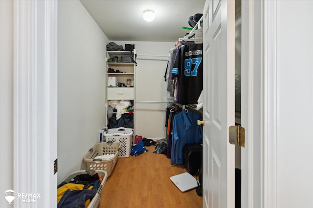 walk in closet featuring hardwood / wood-style floors