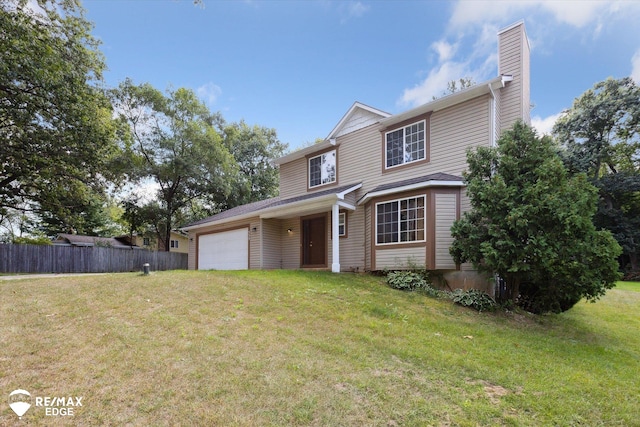 front facade featuring a front lawn and a garage