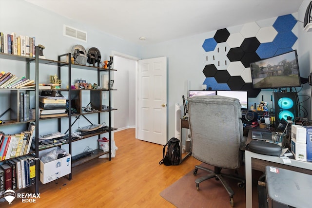 home office with hardwood / wood-style flooring