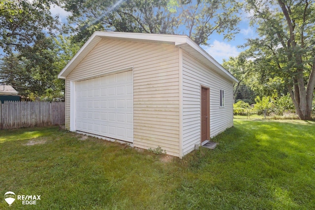 garage featuring a lawn