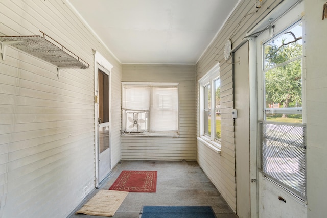 unfurnished sunroom with plenty of natural light