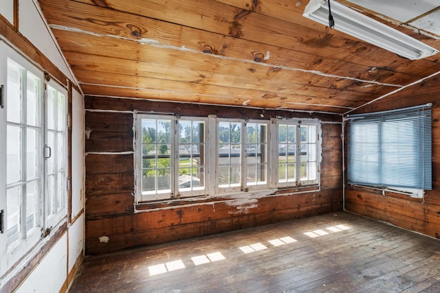 unfurnished sunroom featuring wood ceiling and vaulted ceiling