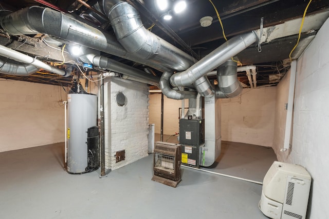 basement featuring gas water heater and heating unit