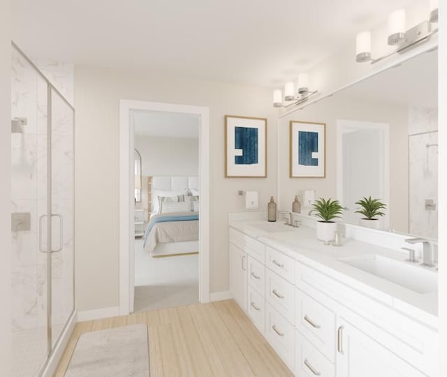 bathroom with vanity, a shower with shower door, and hardwood / wood-style flooring